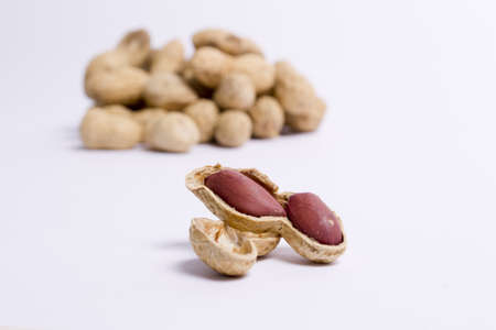 Close-up of peanuts in a heap and unpacked