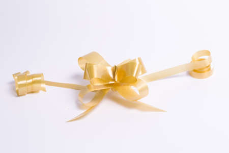 Gold ribbon bow on a white background and Christmas holidays