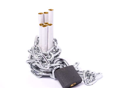 a pile of cigarettes safely out of reach of chains and padlocksの写真素材