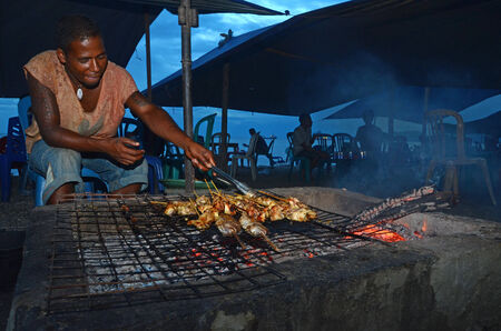Grilled fish traders Kelapaa coast of Dili, Timor Leste on February 5th, 2012.のeditorial素材