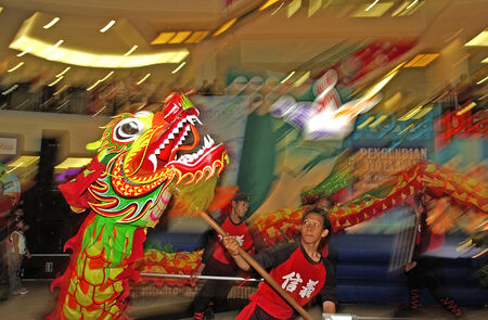 Lion and Dragon Dance Barongsai in Mall Surabaya, Indonesia. The event held in Plaza Surabya and this event is symbol of chinese new year.のeditorial素材