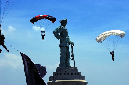 Jumpers across the Monument of Jalesveva Jayamahe roomates means we are at sea this glorious dock Ujung Surabaya, East Java, Indonesia.のeditorial素材