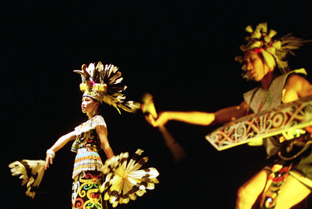 Enggang dancer from Dayak tribe Kalimantan, Indonesia performents at the opera house ini Cak Durasim, Surabaya, East Java Indonesiaのeditorial素材