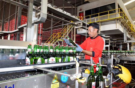 Mojokerto, East Java, Indonesia - April 9, 2015: Production room atmosphere in PT Multi Bintang Indonesia Tbk breweries and bottling facilities in Trawas, Mojokerto, East Java, Indonesia on April 9, 2015. Indonesia has banned small retailers from selling のeditorial素材