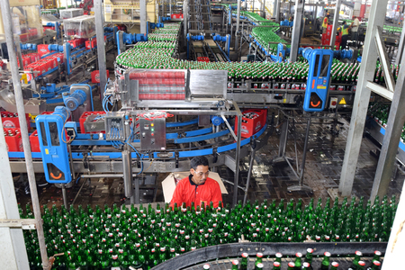 Mojokerto, East Java, Indonesia - April 9, 2015: Production room atmosphere in PT Multi Bintang Indonesia Tbk breweries and bottling facilities in Trawas, Mojokerto, East Java, Indonesia on April 9, 2015. Indonesia has banned small retailers from selling のeditorial素材