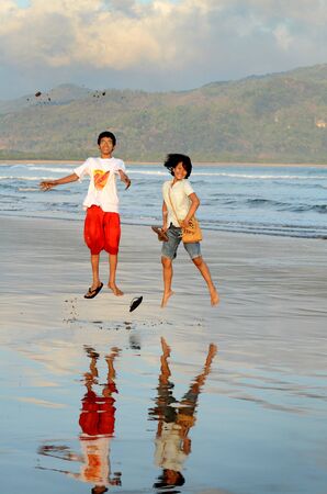 Local tourists playing on Telengria Beach, Pacitan, Eat Java, Indonesia.のeditorial素材
