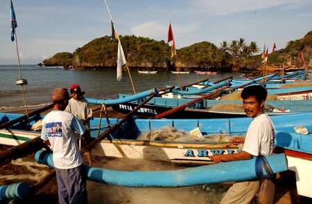 Fisherman on the beach Watu Karung, Pacitan, East Java, Indonesiaのeditorial素材