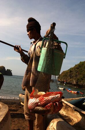 Fisherman on the beach Watu Karung, Pacitan, East Java, Indonesiaのeditorial素材