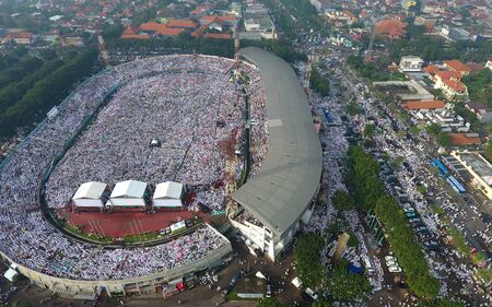 Human millions of followers largest organization in Indonesia, Nahdlatul Ulama (NU) follows the Prayer event at Gelora Delta Sidoarjo Stadium on April 9, 2017のeditorial素材