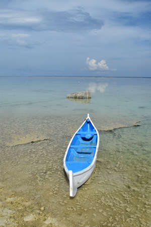 Traditional boat with clean sea on the paradise beach of Gili Labak, Madura, East Java, Indonesiaの写真素材