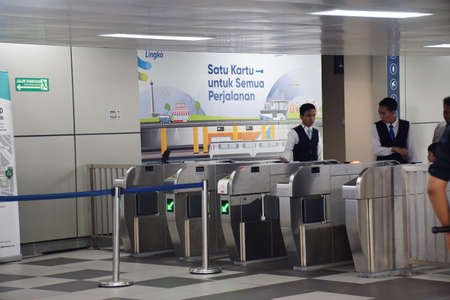Jakarta, Indonesia - July 25, 2019: Guard the entrance at the Lebak Bulus Grab MRT Train station to...