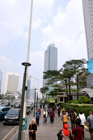 Jakarta, Indonesia - July 25, 2019: Traffic on the road in Central Jakarta during the day around the...