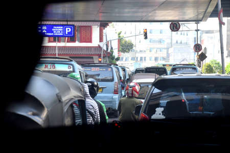 Jakarta, Indonesia - July 23, 2019: The view from a traffic jam car around the Grand Indonesia mall...
