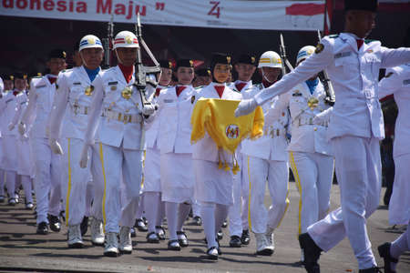 Surabaya, Indonesia - August 17, 2019: Paskibraka, raising the Indonesian flag on the 74th...