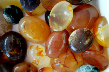 Close up of semi precious tumbled gemstones, cabachons, agate ring from Ponorogo, East Java,...