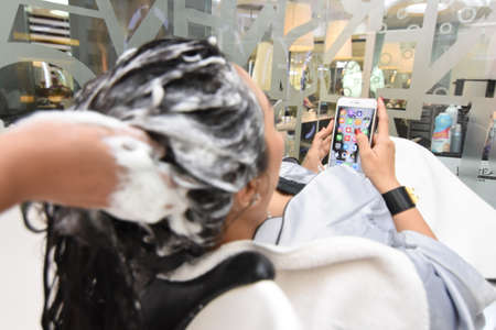 Surabaya, Indonesia - October 06, 2016: A model doing hair care at the famous salon Galaxy Mall...
