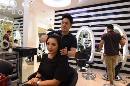 Surabaya, Indonesia - October 06, 2016: A model doing hair care at the famous salon Galaxy Mall Surabaya, East Java, Indonesiaのeditorial素材