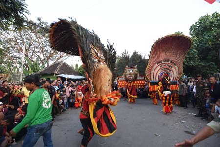 The Reog Ponorogo community held a show on the village road in a carnival in Dagangan village, Madiun, East Java, Indonesia on July 2, 2017