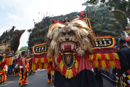 The Reog Ponorogo community begins a cultural parade at the celebration of the 724 anniversary of Surabaya, Indonesia's largest city on May 7, 2017のeditorial素材