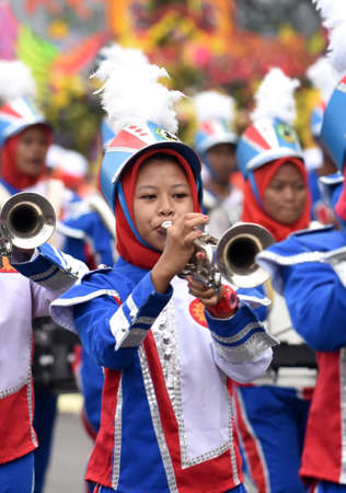 Student marching band for cultural parade at the celebration to commemorate the 724th anniversary of Surabaya, the second largest city in Indonesia on May 7, 2017のeditorial素材