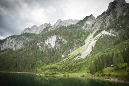 Amazing summer nature of Gosausee (Vorderer) lake with Dachstein glacieron background. Beauty of...
