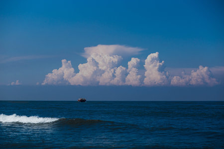 Beautiful seascape with a ship in the sea and cloudsの写真素材