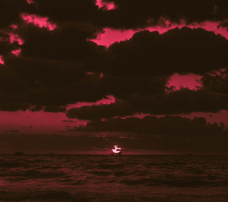 Beautiful sunset over the sea. Vintage style toned picture.の写真素材