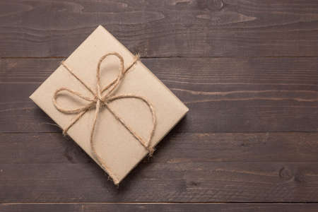 Gift box is on the wooden background with empty space.の写真素材