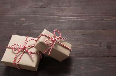 ift boxes are on the wooden background with empty space.