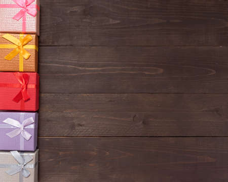 Gift boxes are on the wooden background with empty space.の写真素材
