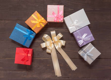 Gift boxes are on the wooden background with empty space.の写真素材