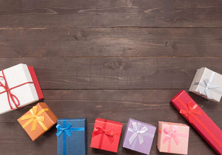 Gift boxes are on the wooden background with empty space.の写真素材