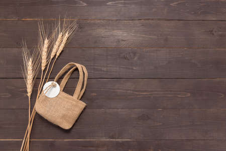  Hessian sack bag with rice bale on the wooden background.の写真素材