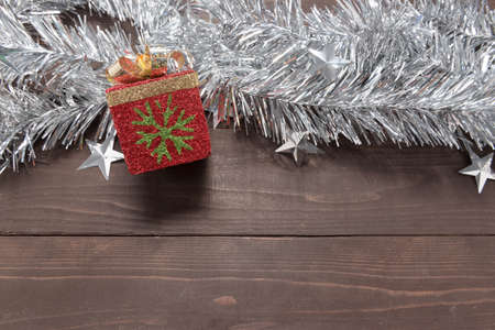 Gift box is on the wooden background with empty space for Christmas day.
