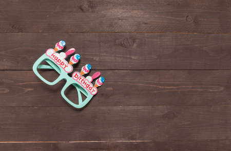 Gree glasses with Happy Birthday massage is on the wooden background. の写真素材