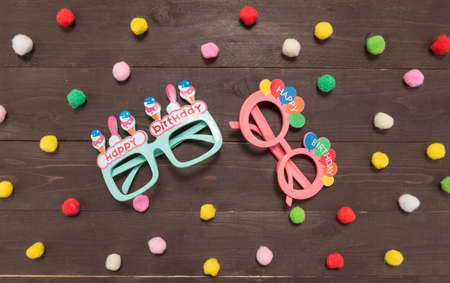 Polka dot background and glasses on the wood with copy space.の写真素材