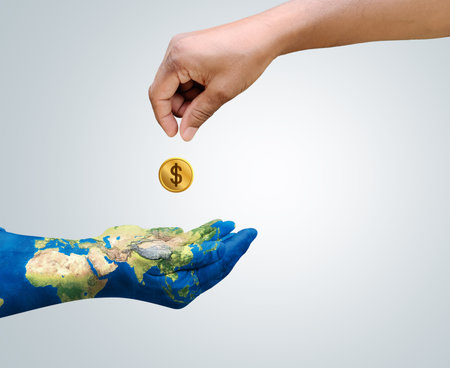 Invest in our planet. Earth day  concept background. Ecology concept. Design with map on hand isolated on white background.の写真素材