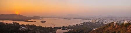 A panoramic image of Udaipur and Lake Pichola, Indiaの写真素材