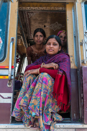 Indian women in colorful saris in a truck, India のeditorial素材