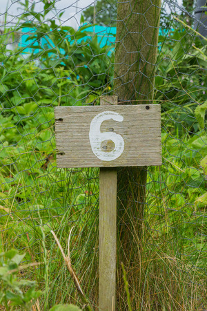 Wooden sign giving garden plot numberの写真素材