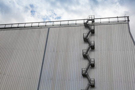 Fire escape ladder on modern industrial buildingの写真素材