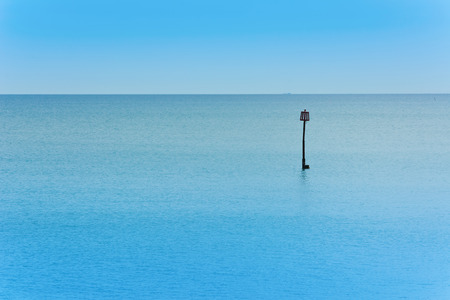 View out to sea on a calm summer's eveningの写真素材