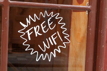 Shop window with free hand painted on glassの写真素材