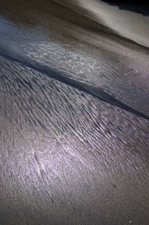 Surf formed Patterns in the sand