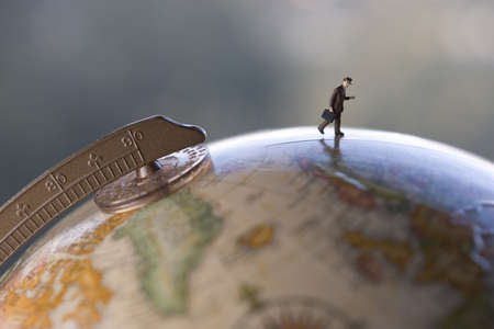 Business travel figure on globeの写真素材