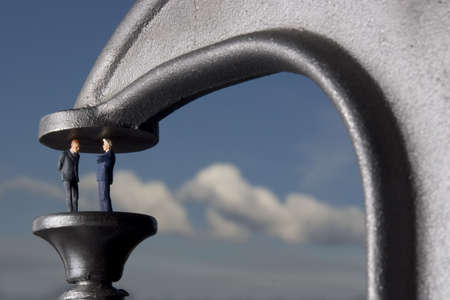 Businessmen in a clampの写真素材