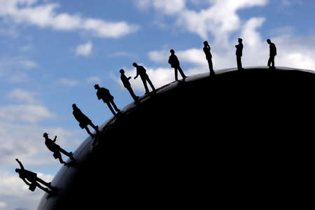 Business figurines and earth globe.の写真素材