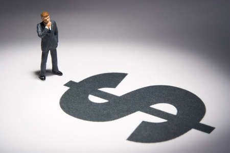 Business figures and dollar signの写真素材