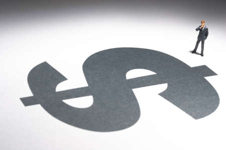 Business figures and dollar signの写真素材