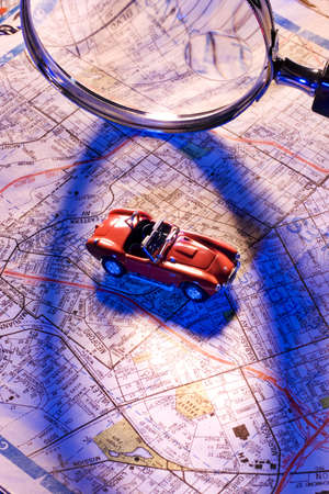 Magnifying glass, map and toy car